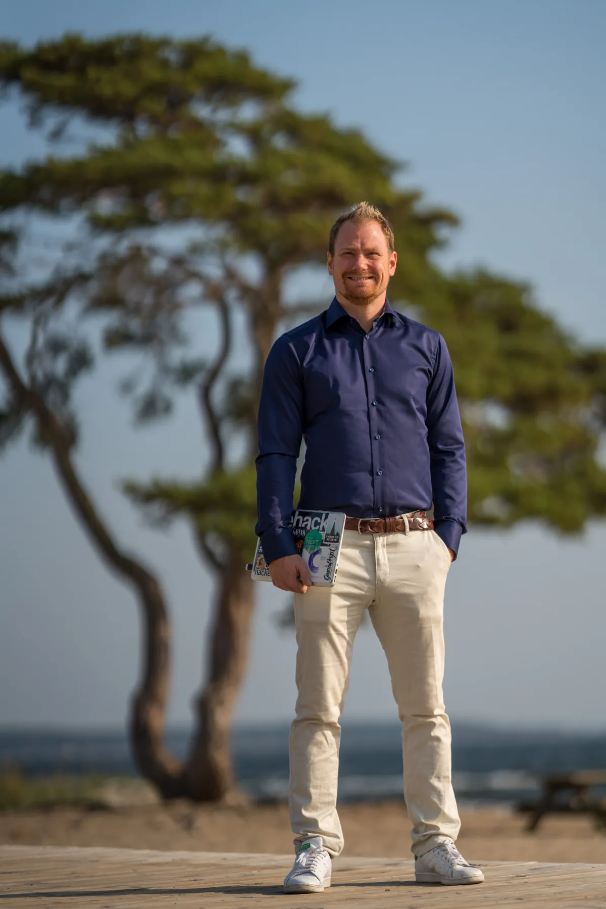 David Jacoby by a pine tree at the coast